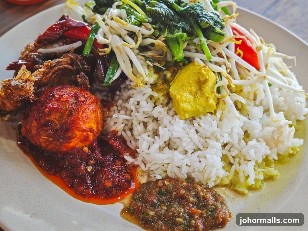Nasi Lemak with Fried Chicken and Sambal Egg
