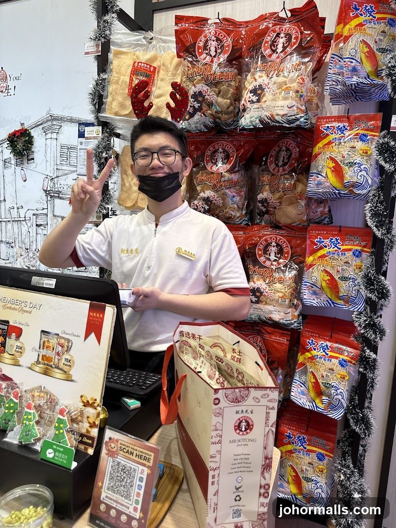 Snack shop employee with products