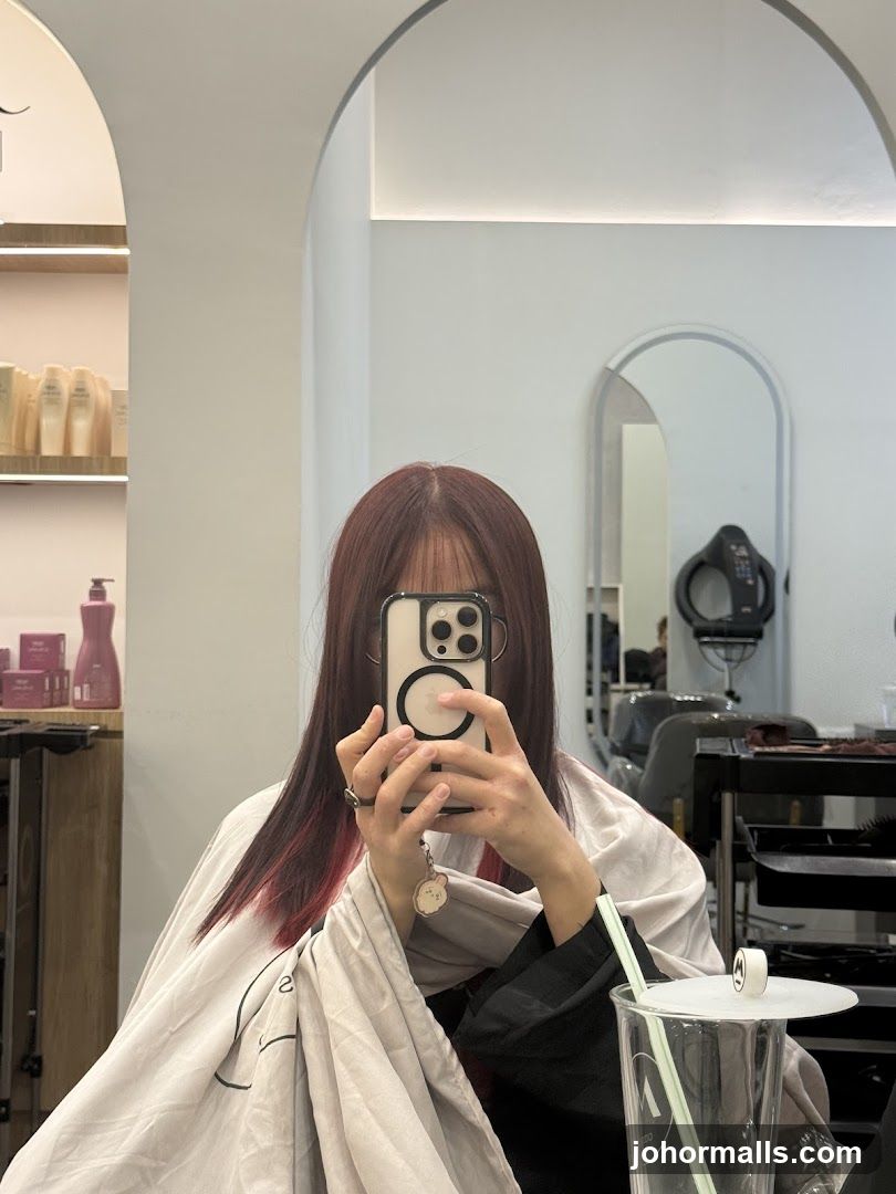 Woman taking a selfie in a salon