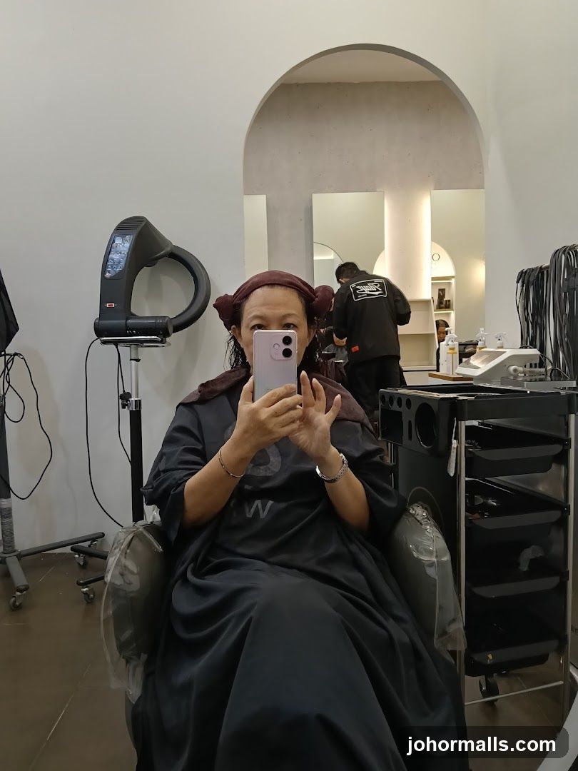 Woman taking a selfie in a salon