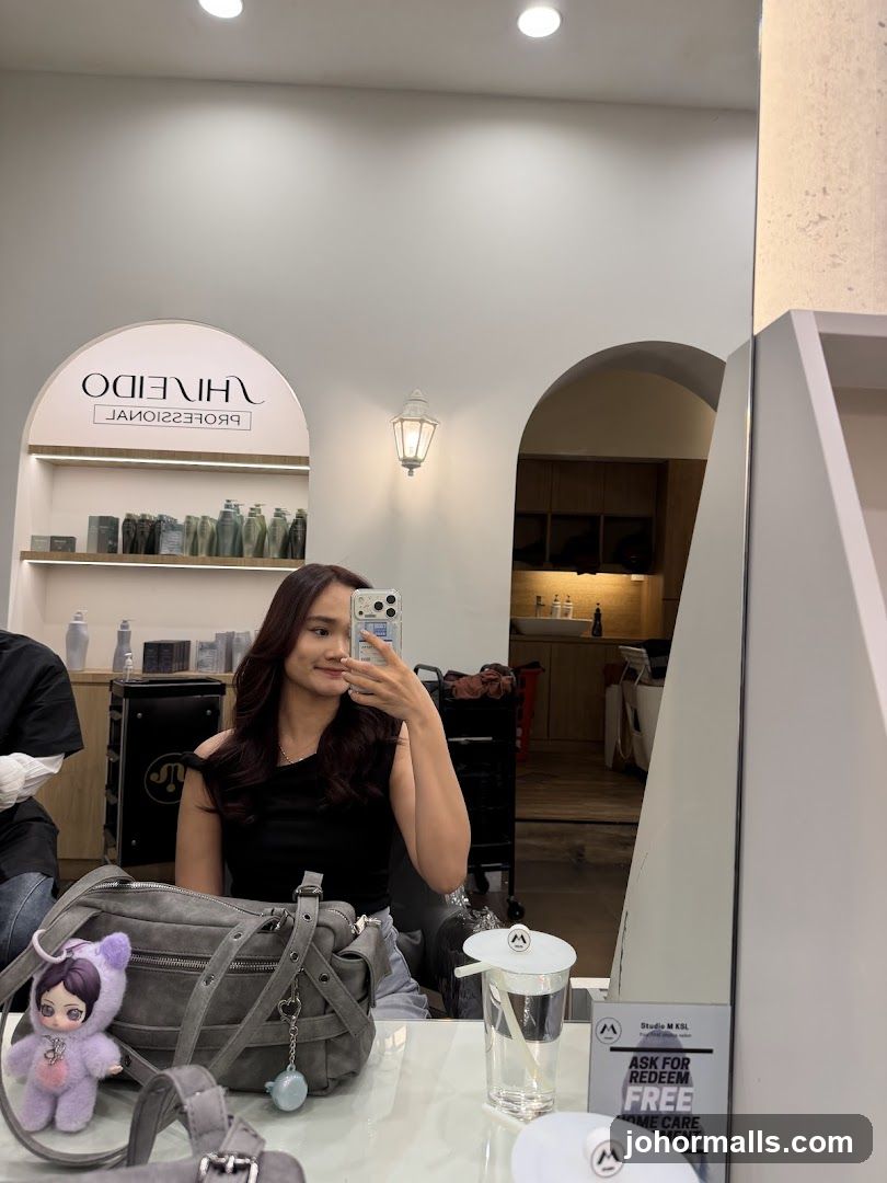 Woman taking a selfie in a salon
