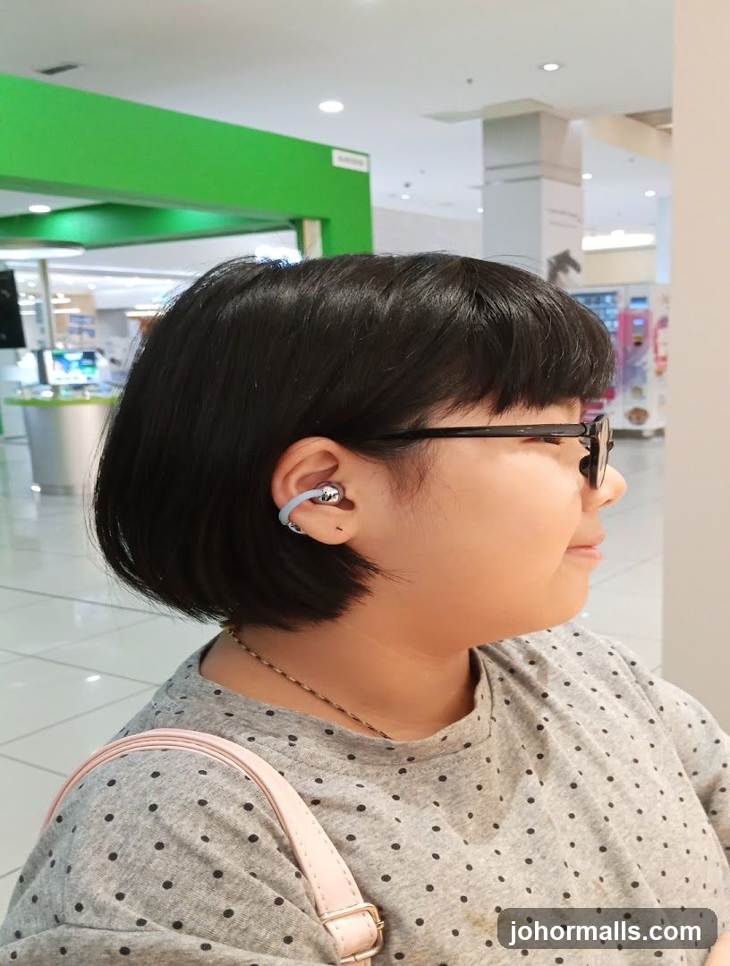Woman wearing earbuds
