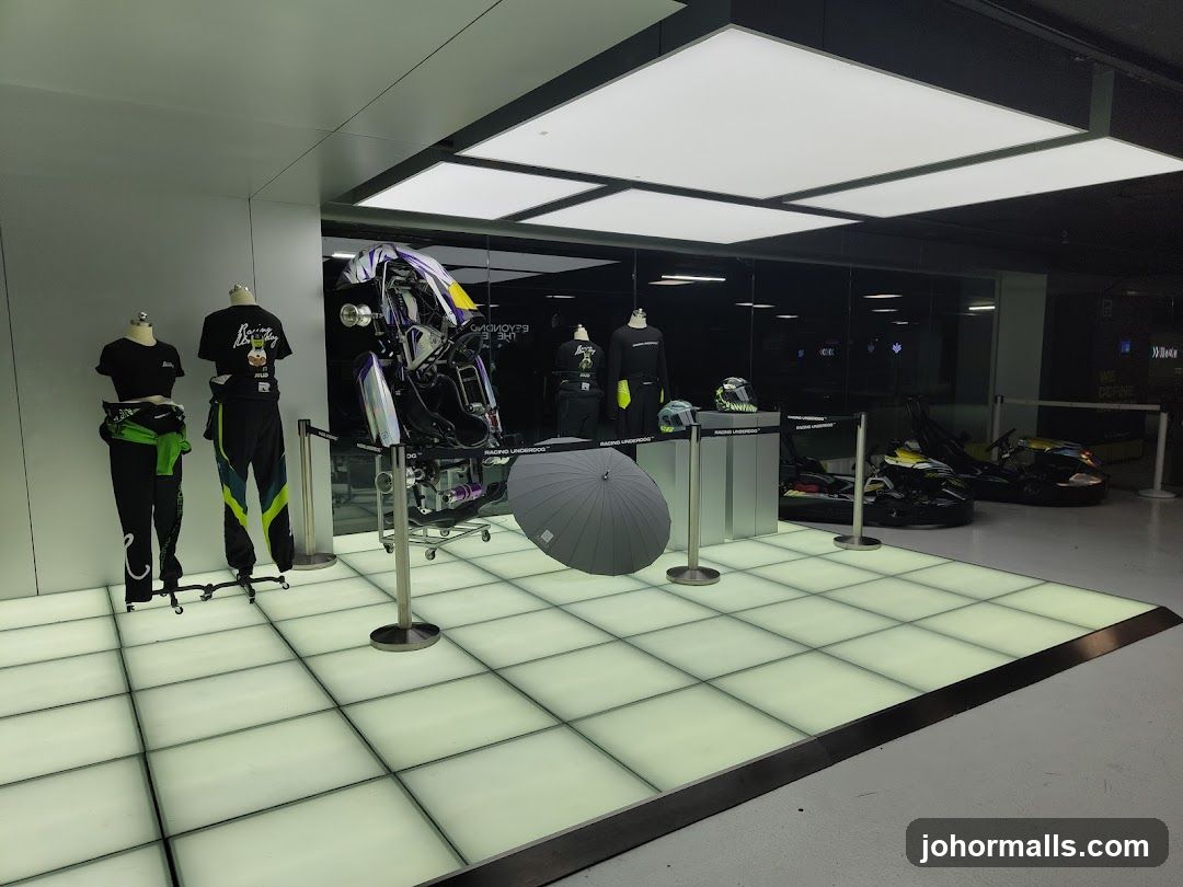 Racing apparel and go-karts on display