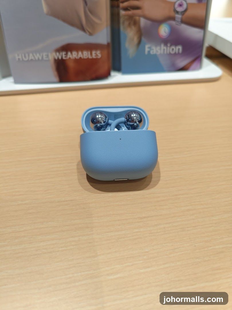Blue wireless earbuds in charging case
