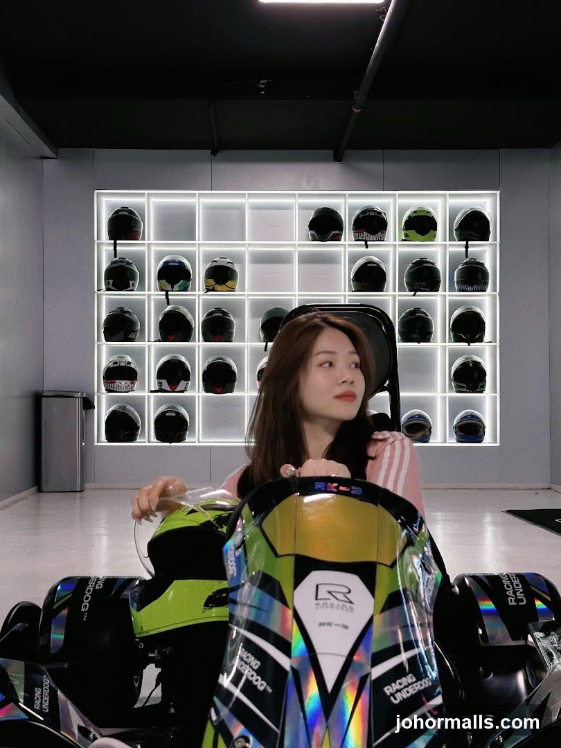 Woman in Go-Kart with Helmets Display