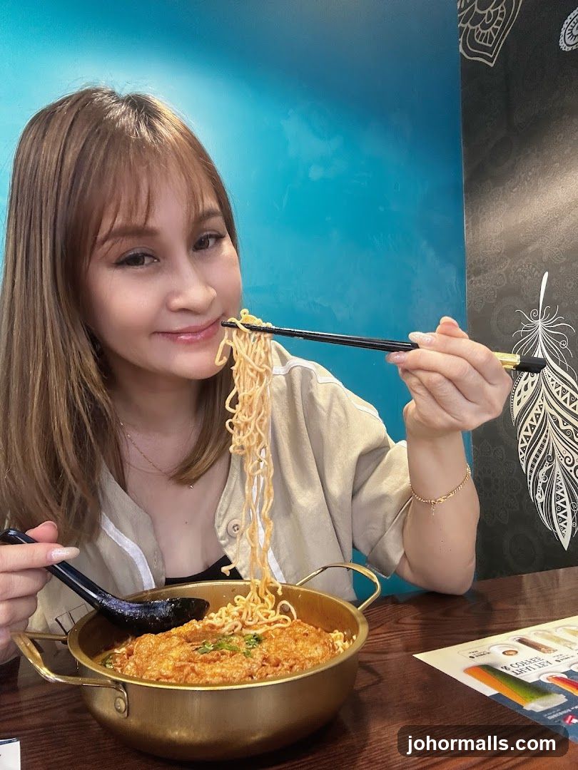 Woman eating noodles