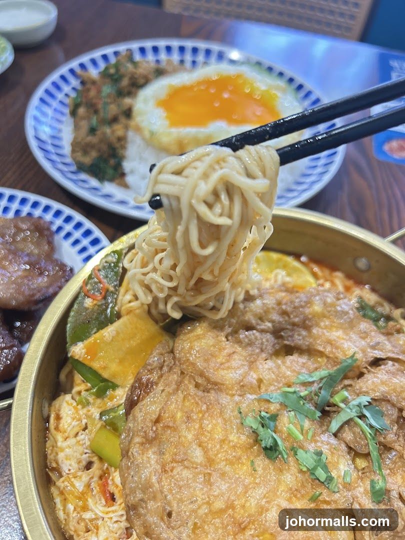 Noodle Dish with Fried Egg and Meat