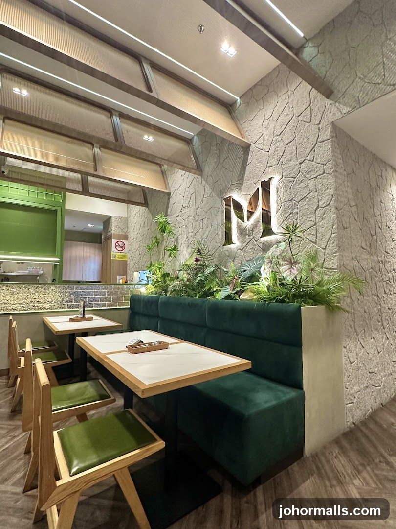 Restaurant Interior with Green Seating and Stone Wall