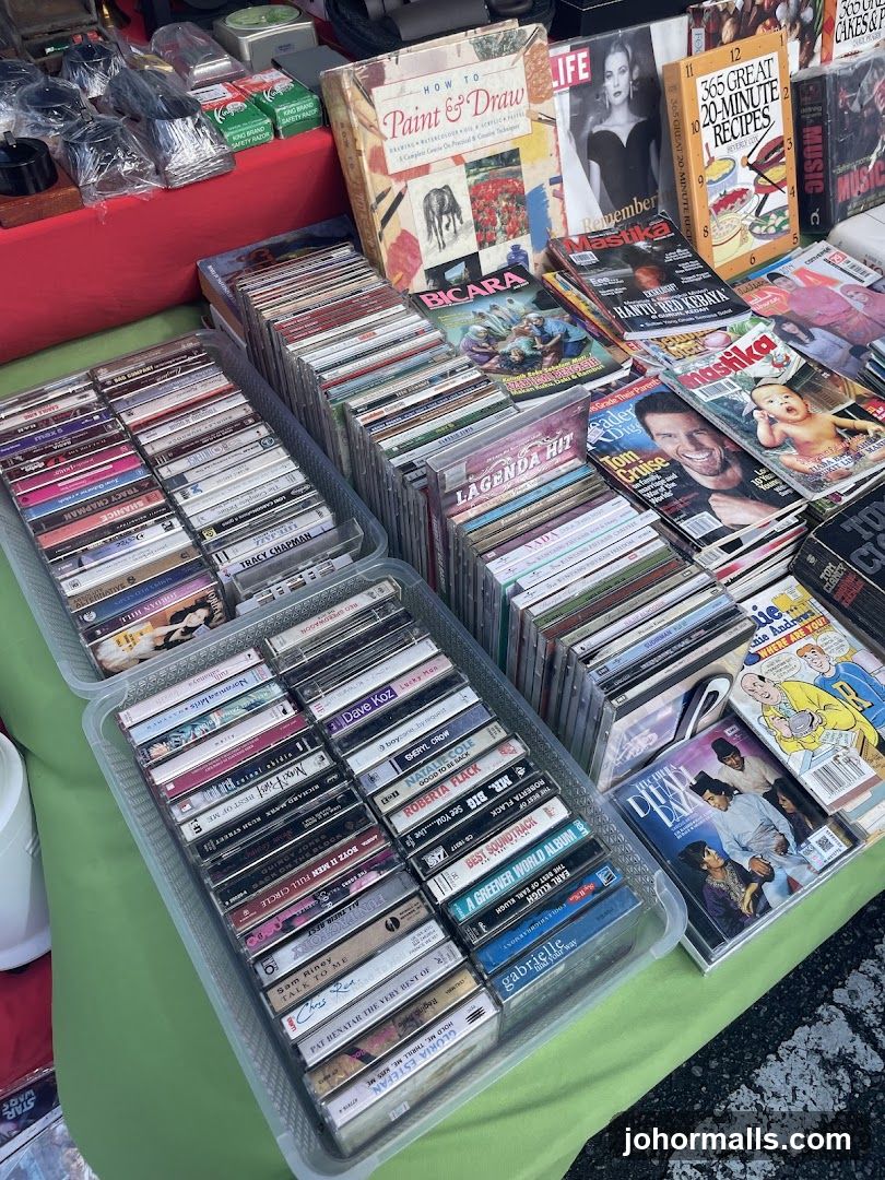 Assortment of CDs, Cassettes, Books, and Magazines