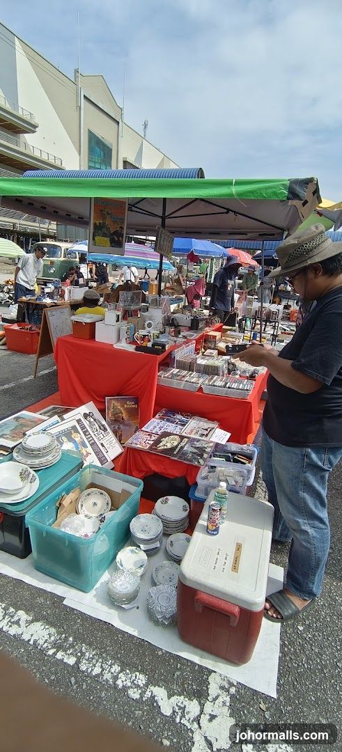 Outdoor market stall with various items for sale