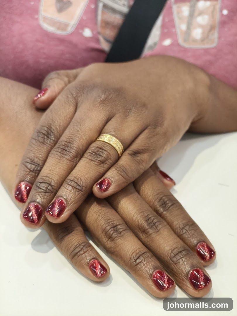 Woman's Hands with Red Cat Eye Nails
