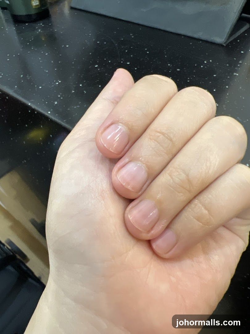Close-up of a hand with natural nails