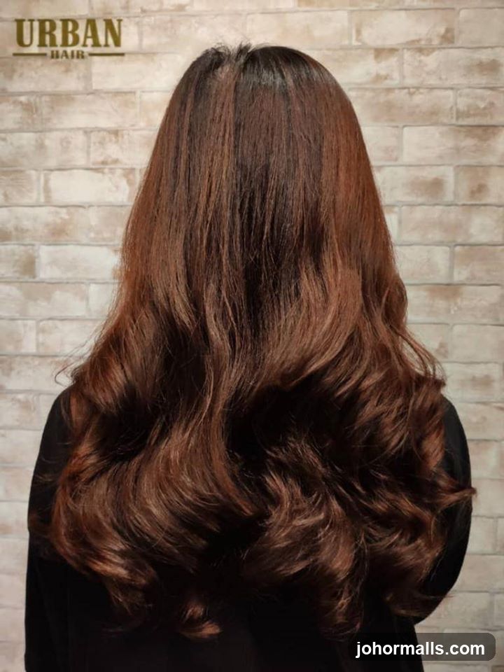 Woman with long, wavy brown hair