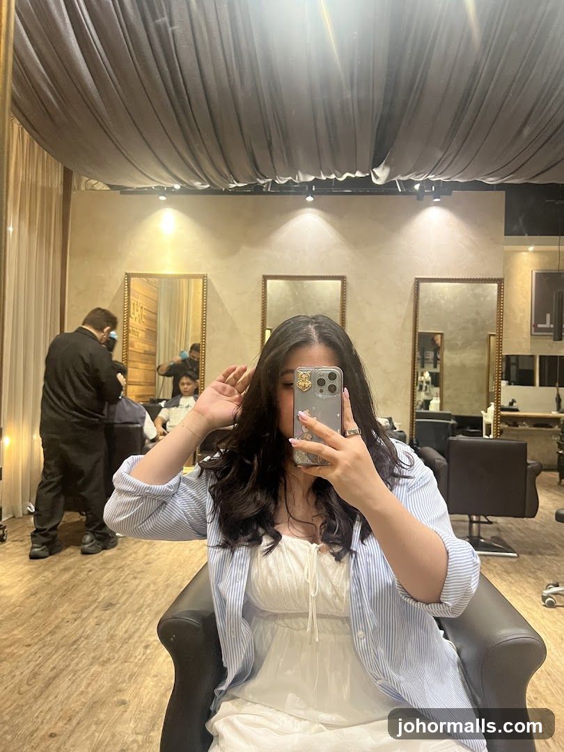Woman taking a selfie in a salon