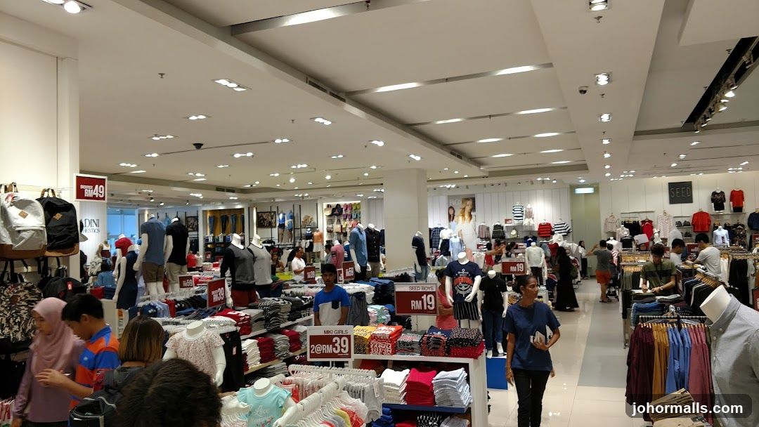 Clothing store interior with mannequins and merchandise