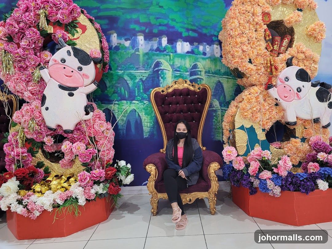 Woman Poses in Front of Festive Decorations