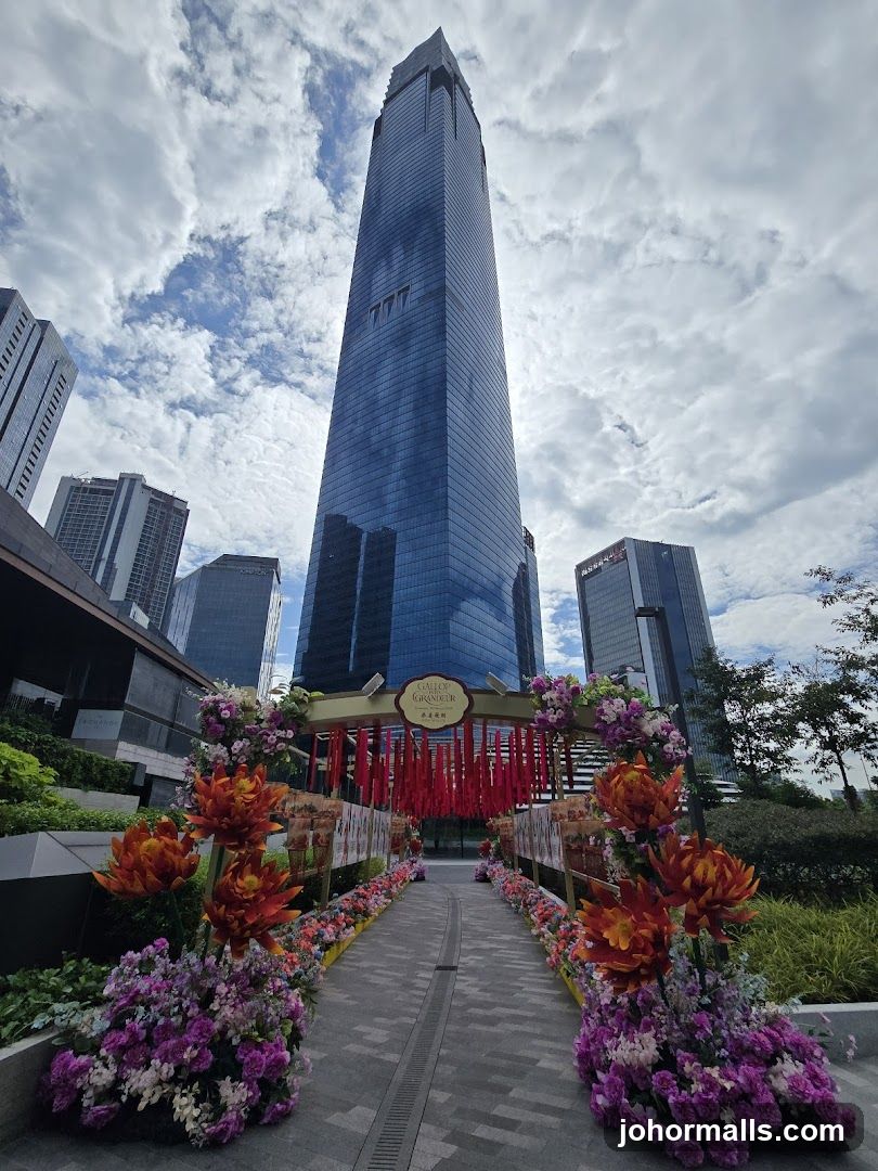 Floral Archway Leading to Tall Skyscraper