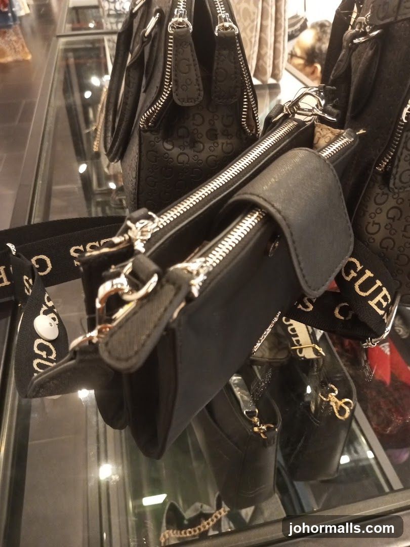 Black handbags with embossed logo