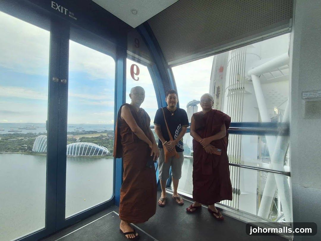Three people in a capsule with a view of Singapore