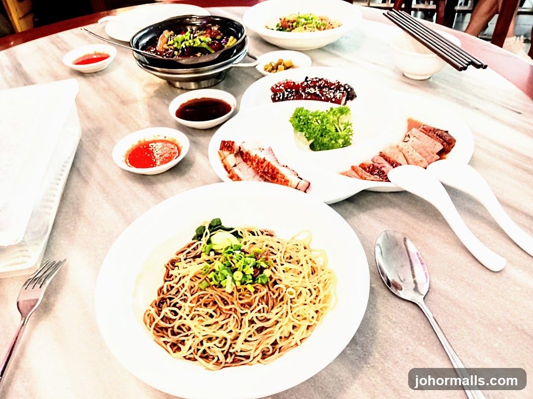 Table with Roasted Meats and Noodles