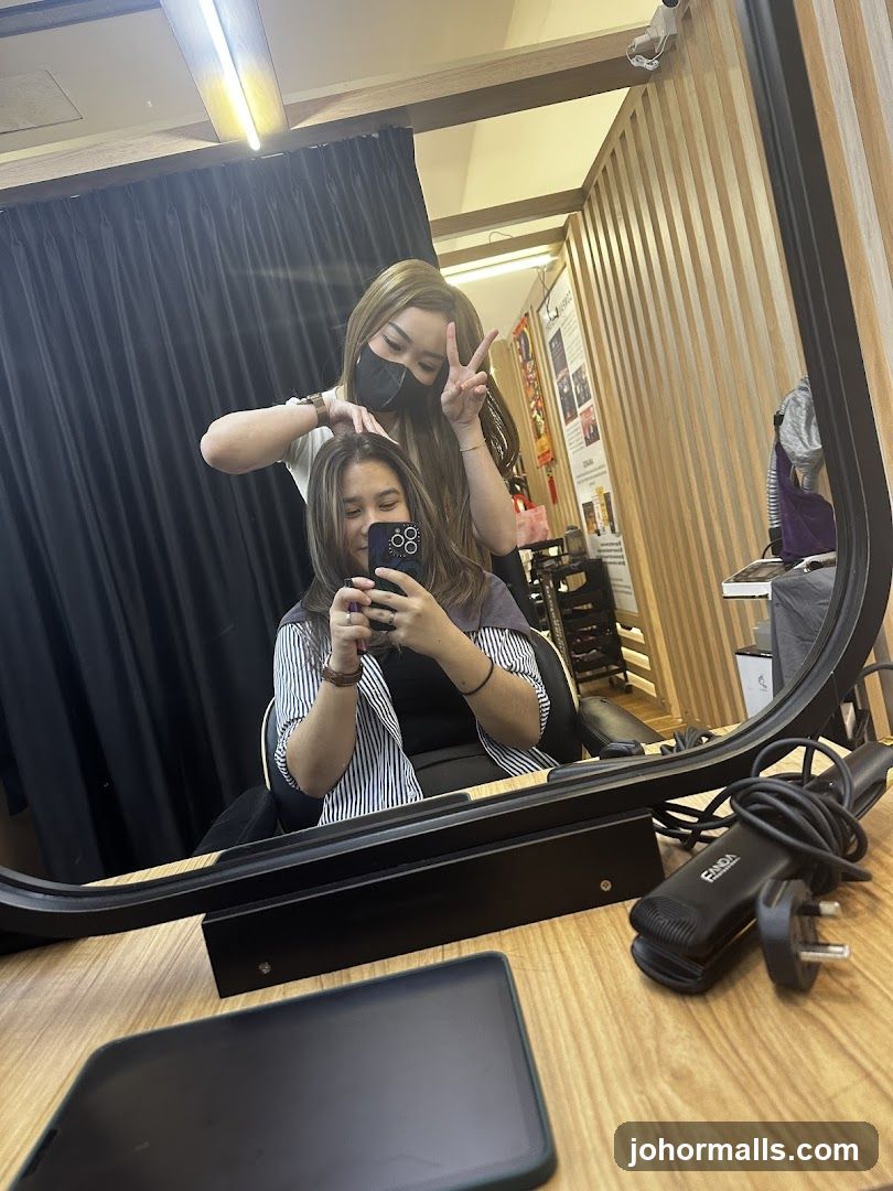 Hairdresser styling client's hair