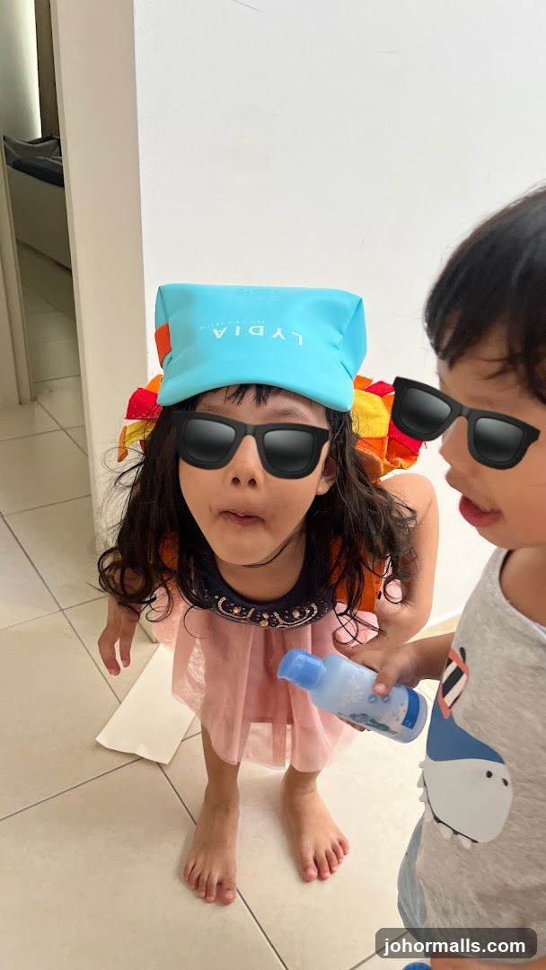 Children wearing sunglasses and a hat