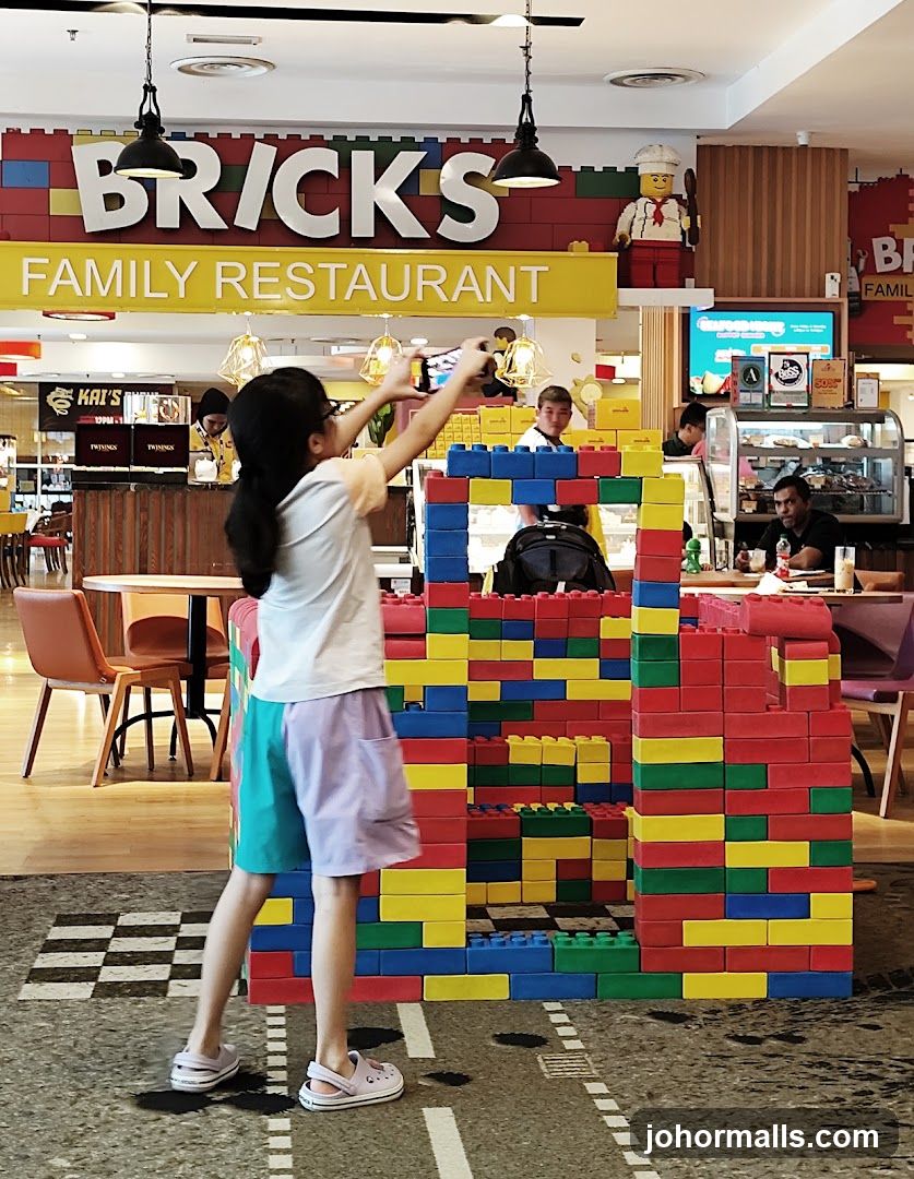 Children playing with large building blocks in a restaurant