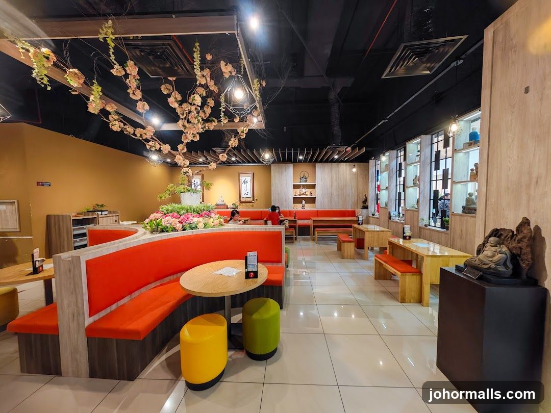 Restaurant Interior with Cherry Blossoms and Buddha Statues