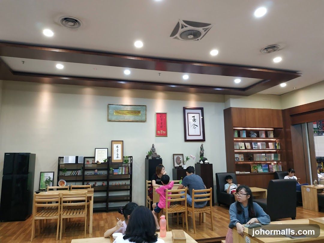 Interior of a cafe with people dining and reading