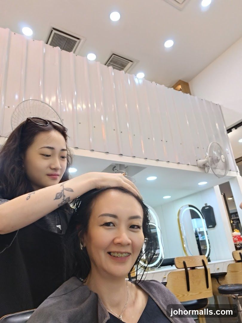 Hairdresser styling a client's hair
