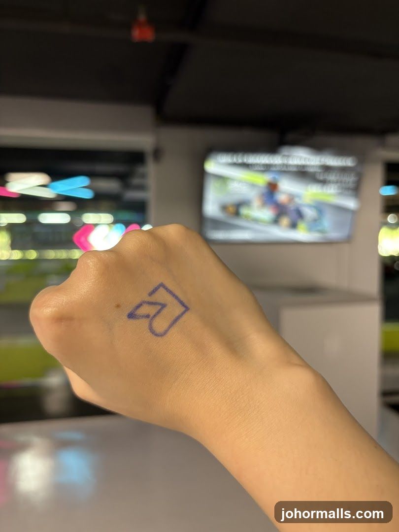 Hand with Logo and Go-Karting Screen