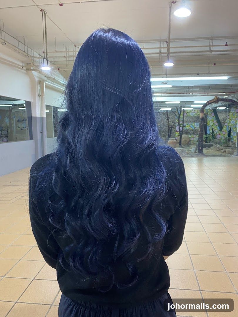 Woman with dark blue wavy hair