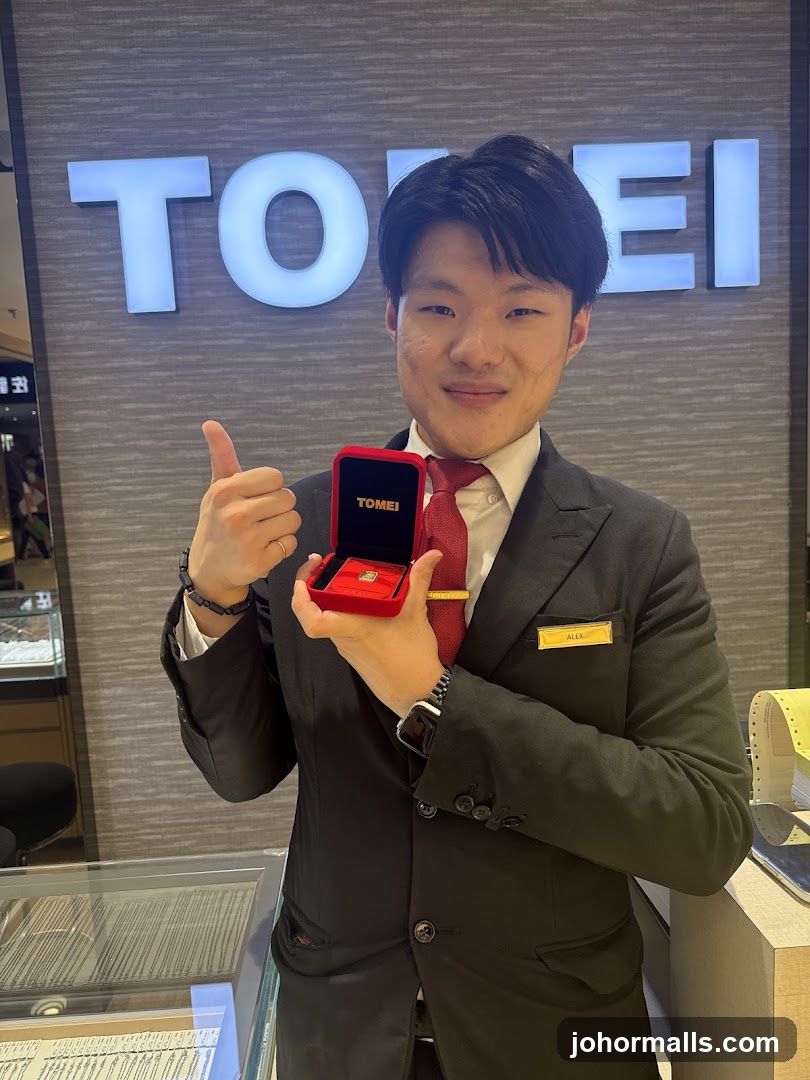 Salesperson holding a gold bar