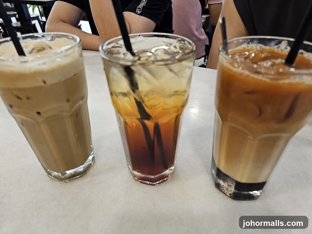 Three iced drinks on a table