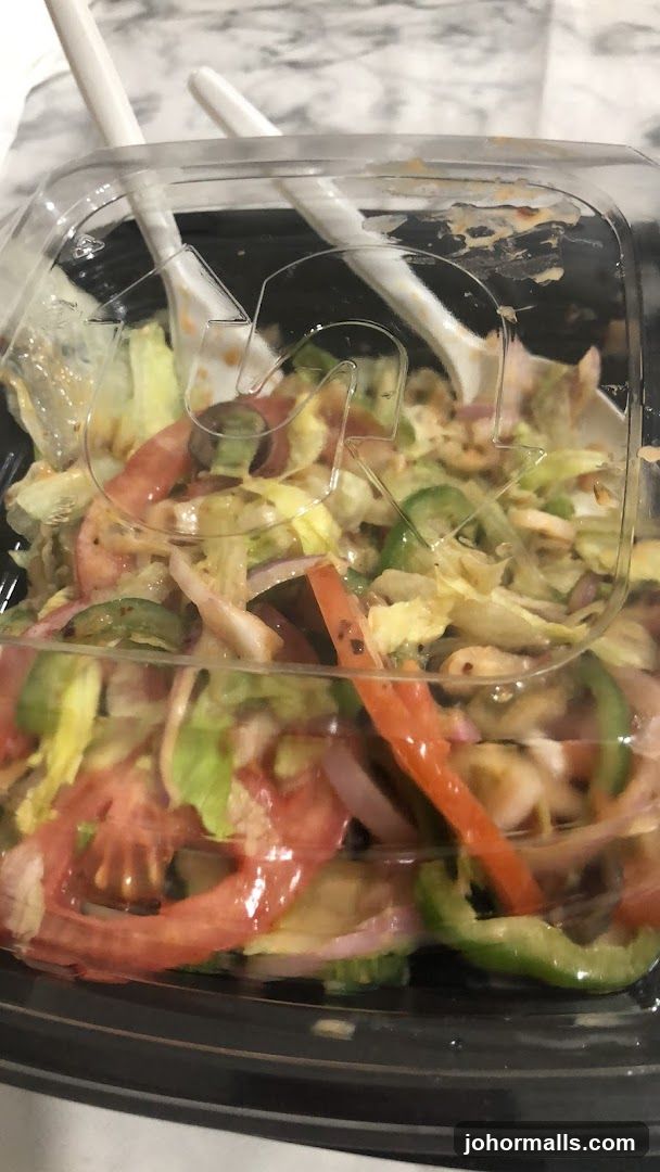 Salad in a clear plastic container