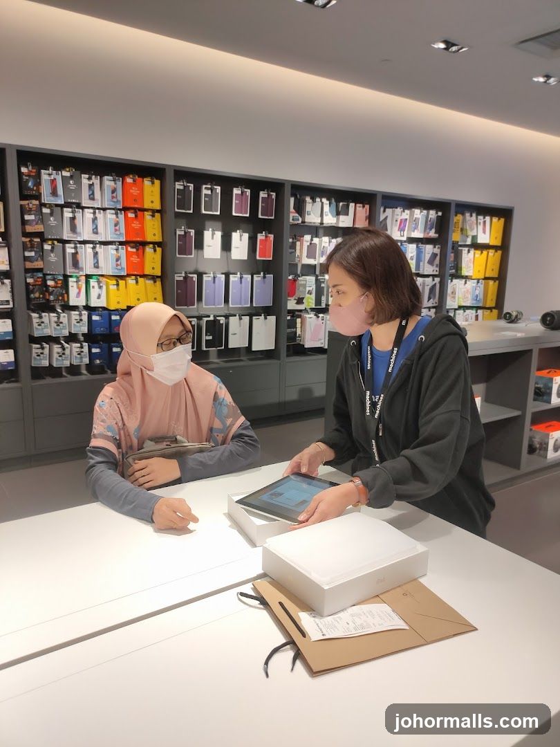 Customer and staff interacting at a store