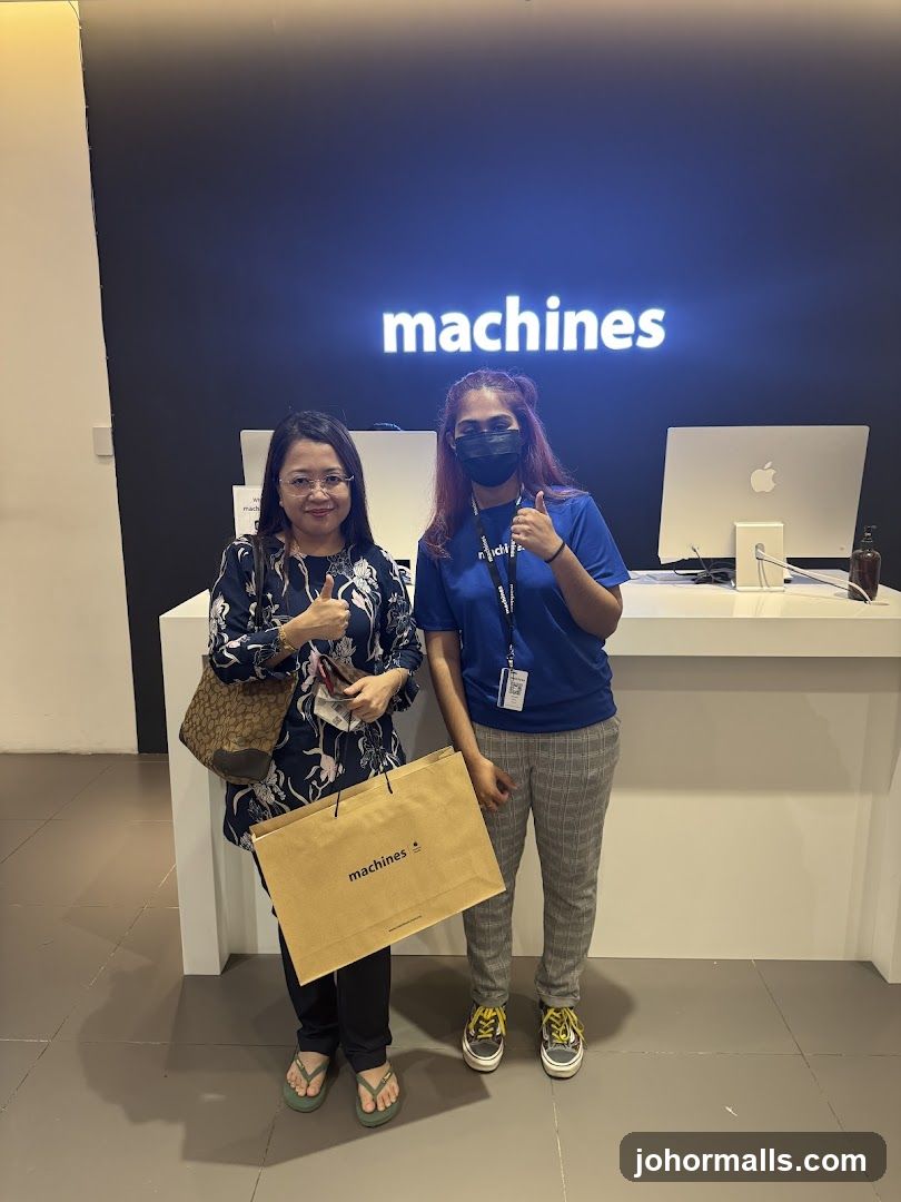 Two people in front of a store sign