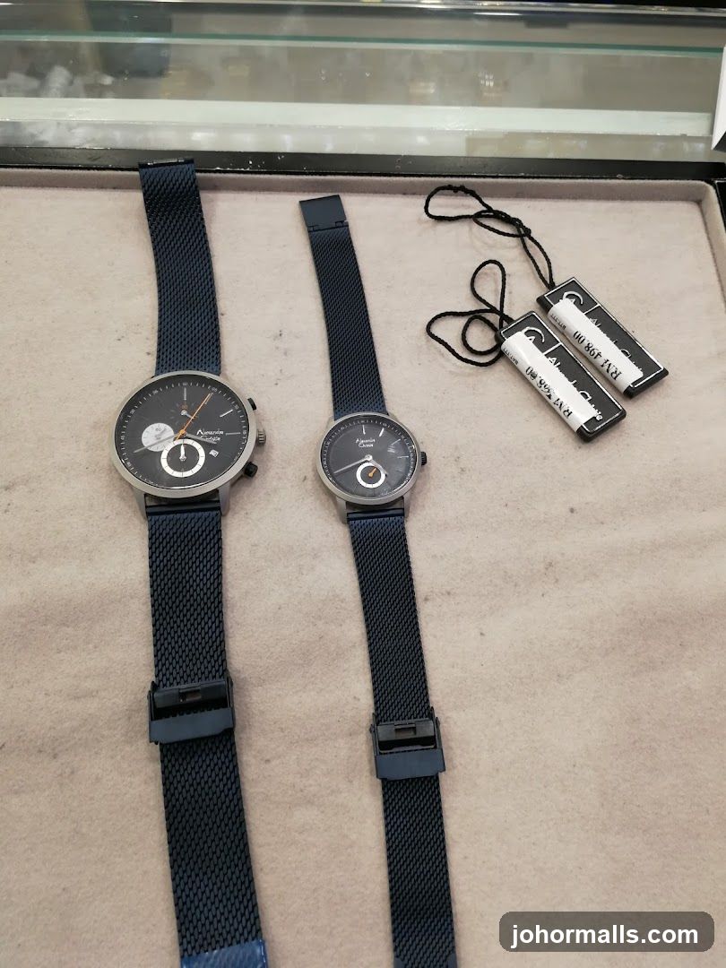 Two watches with blue mesh straps