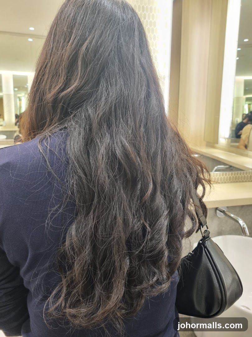 Woman with long, wavy dark hair