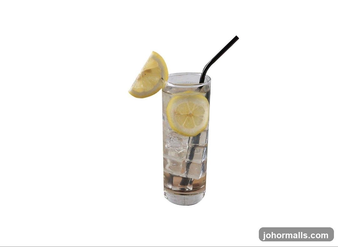 Glass of water with lemon and ice