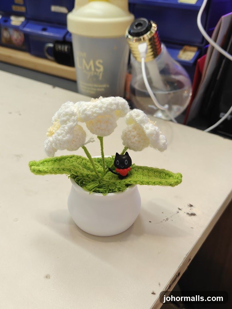 Crocheted Flowers with Cat Figurine