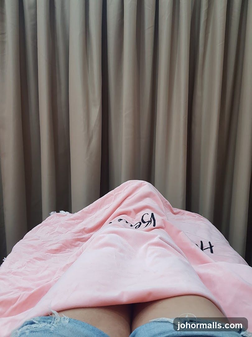 Person under a pink blanket