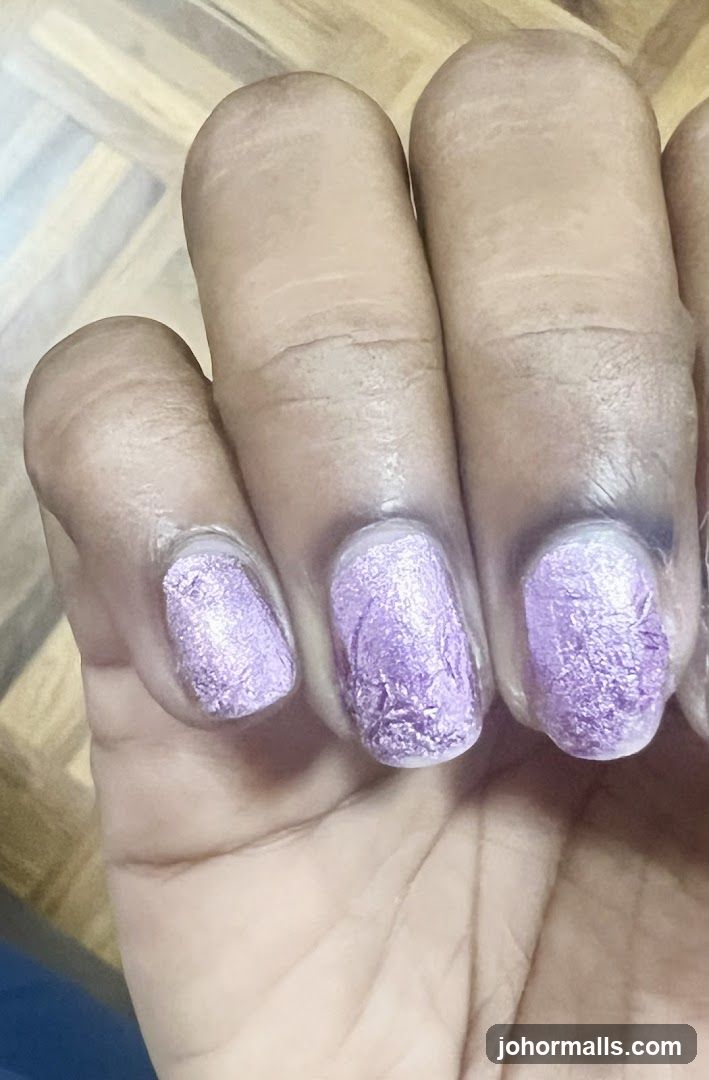 Fingers with Purple Nail Polish