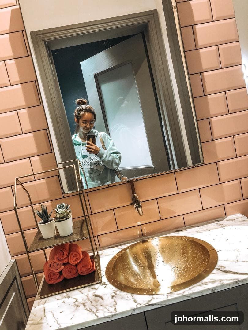 Woman taking a selfie in a bathroom