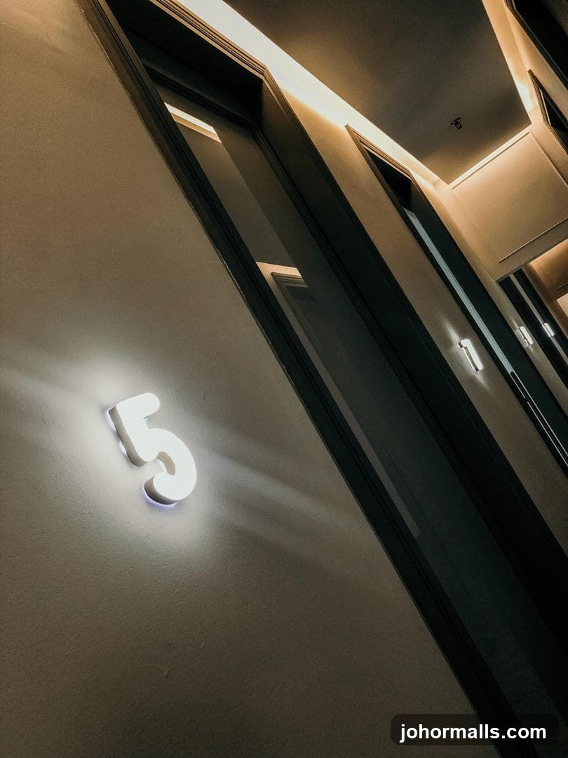 Illuminated Number 5 on a Wall