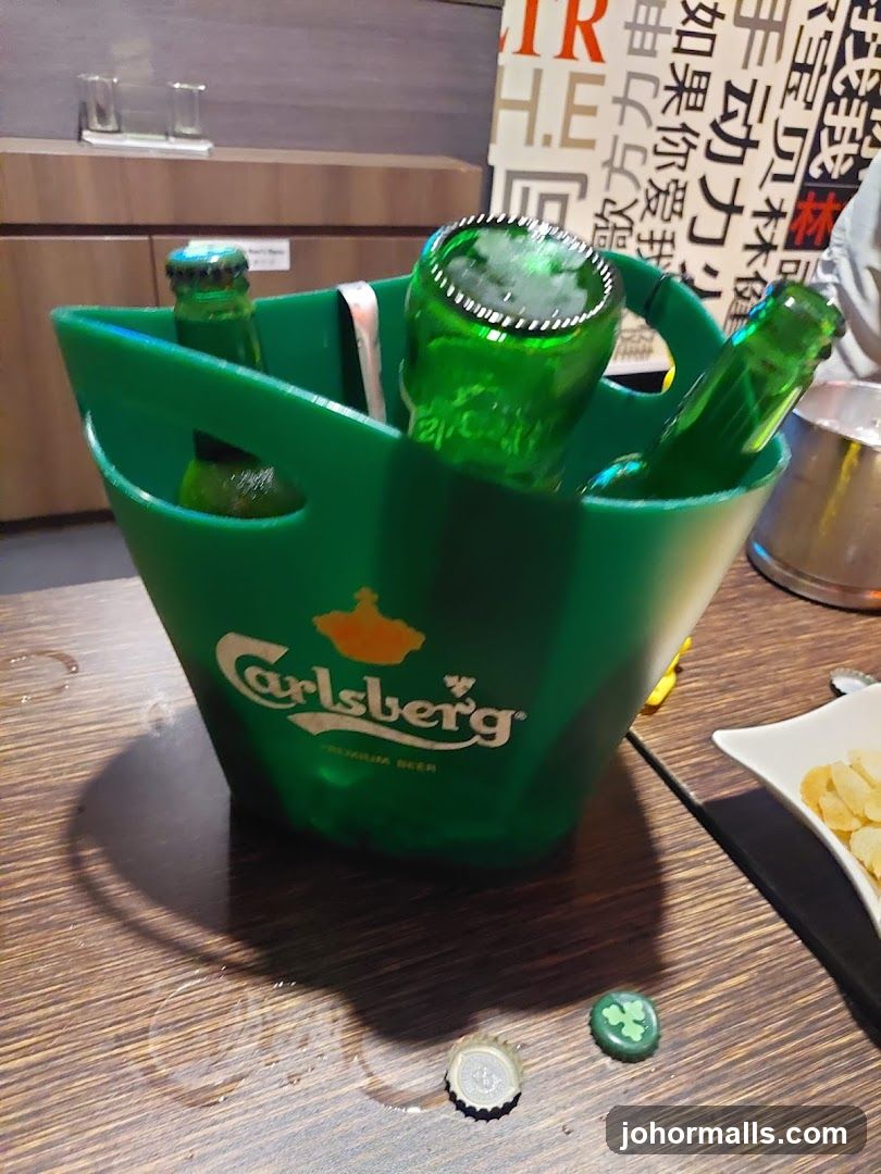 Carlsberg beer bucket on table