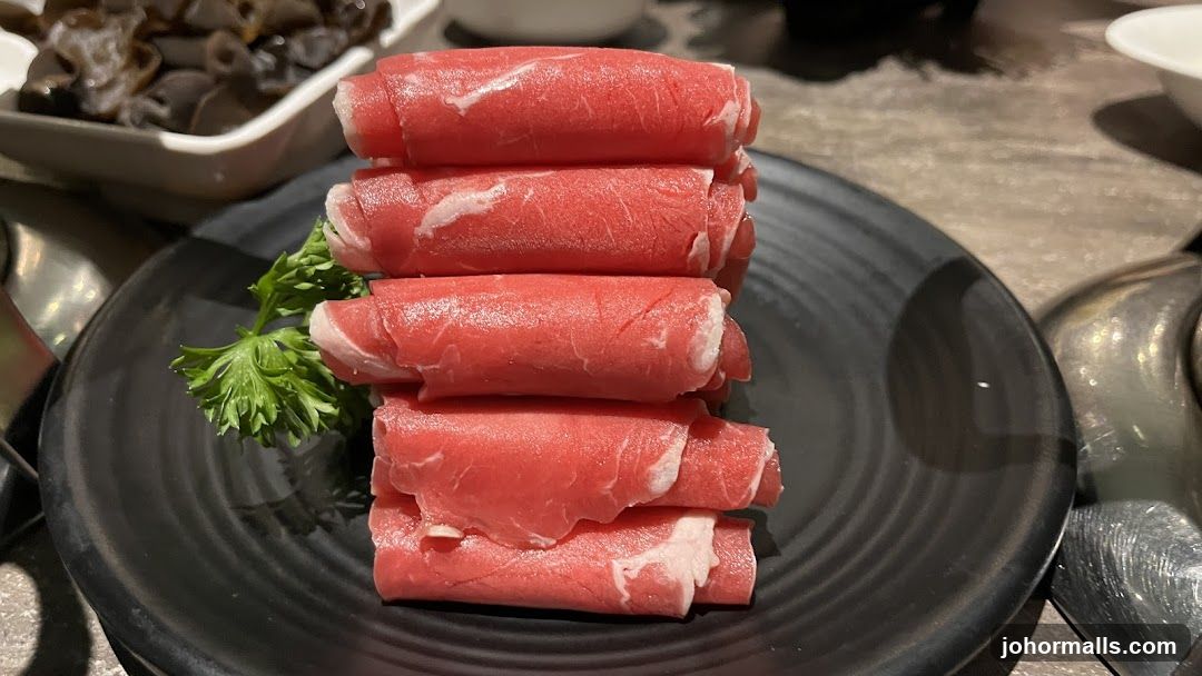Raw Meat Slices on Plate