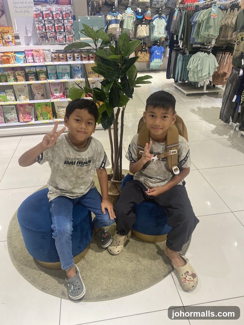 Two boys sitting in a store