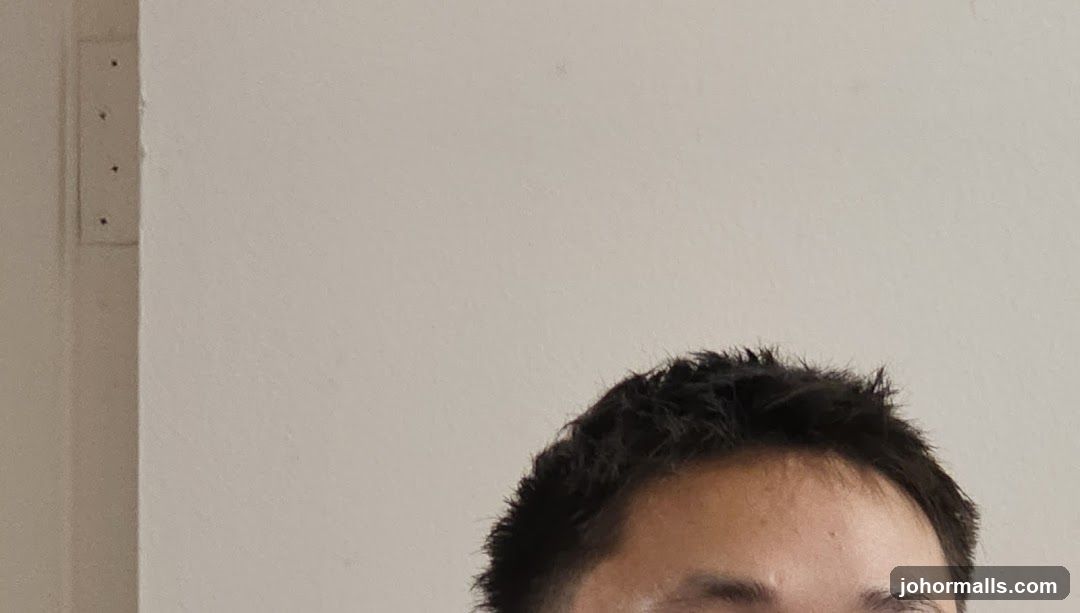Close-up of a person's hair and forehead