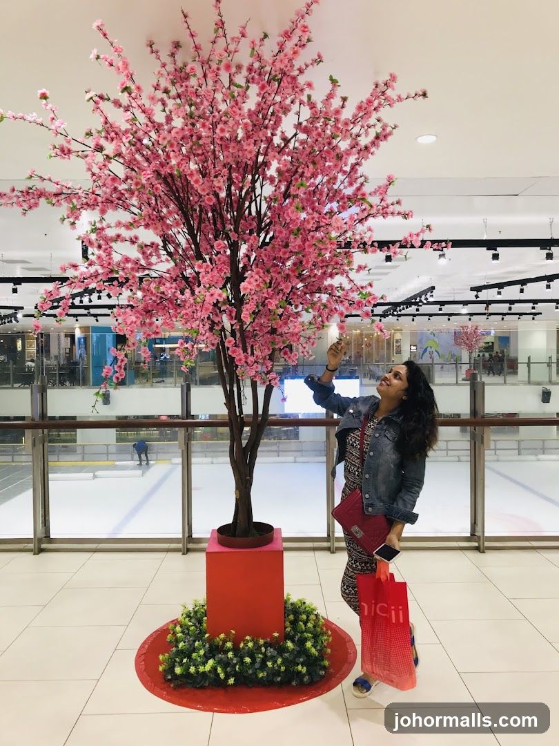 Woman admiring a cherry blossom tree